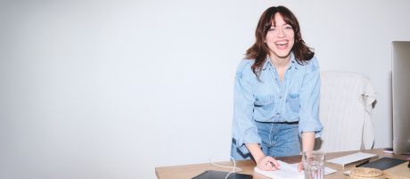 Woman at desk with laptop
