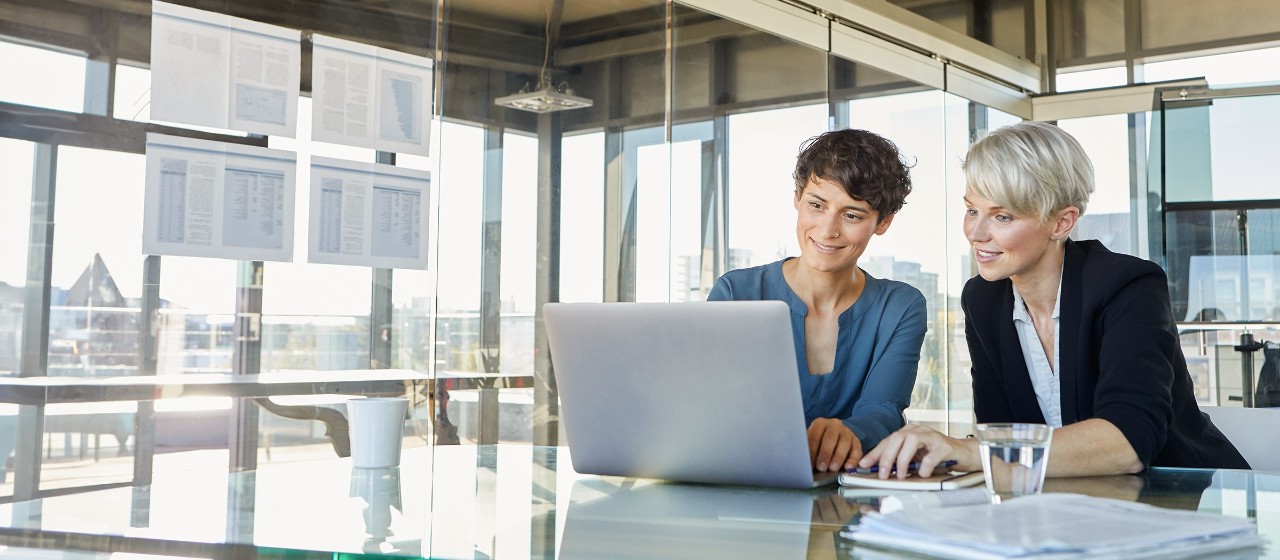 Woman at desk with laptop